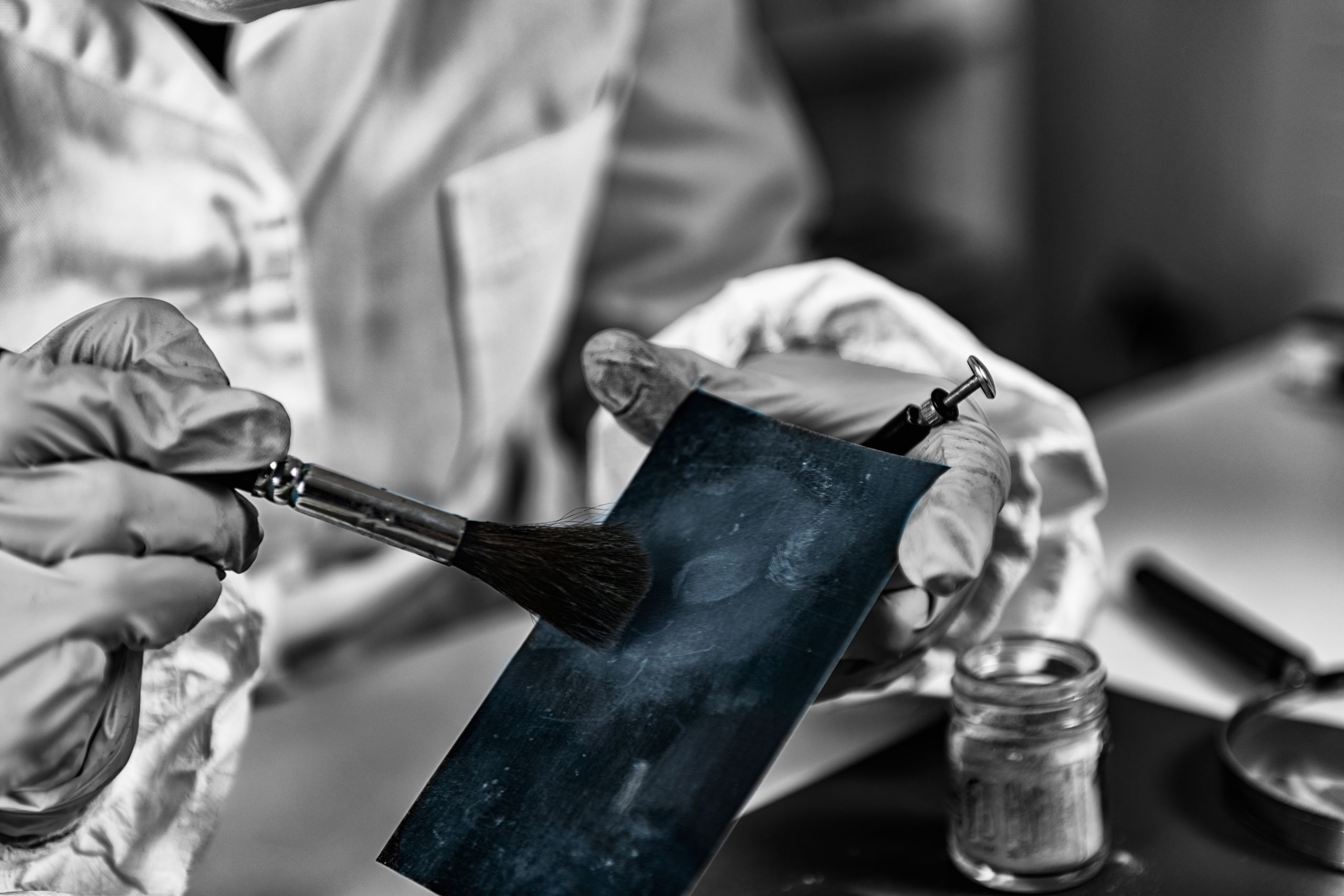 Forensic science investigator collecting fingerprints