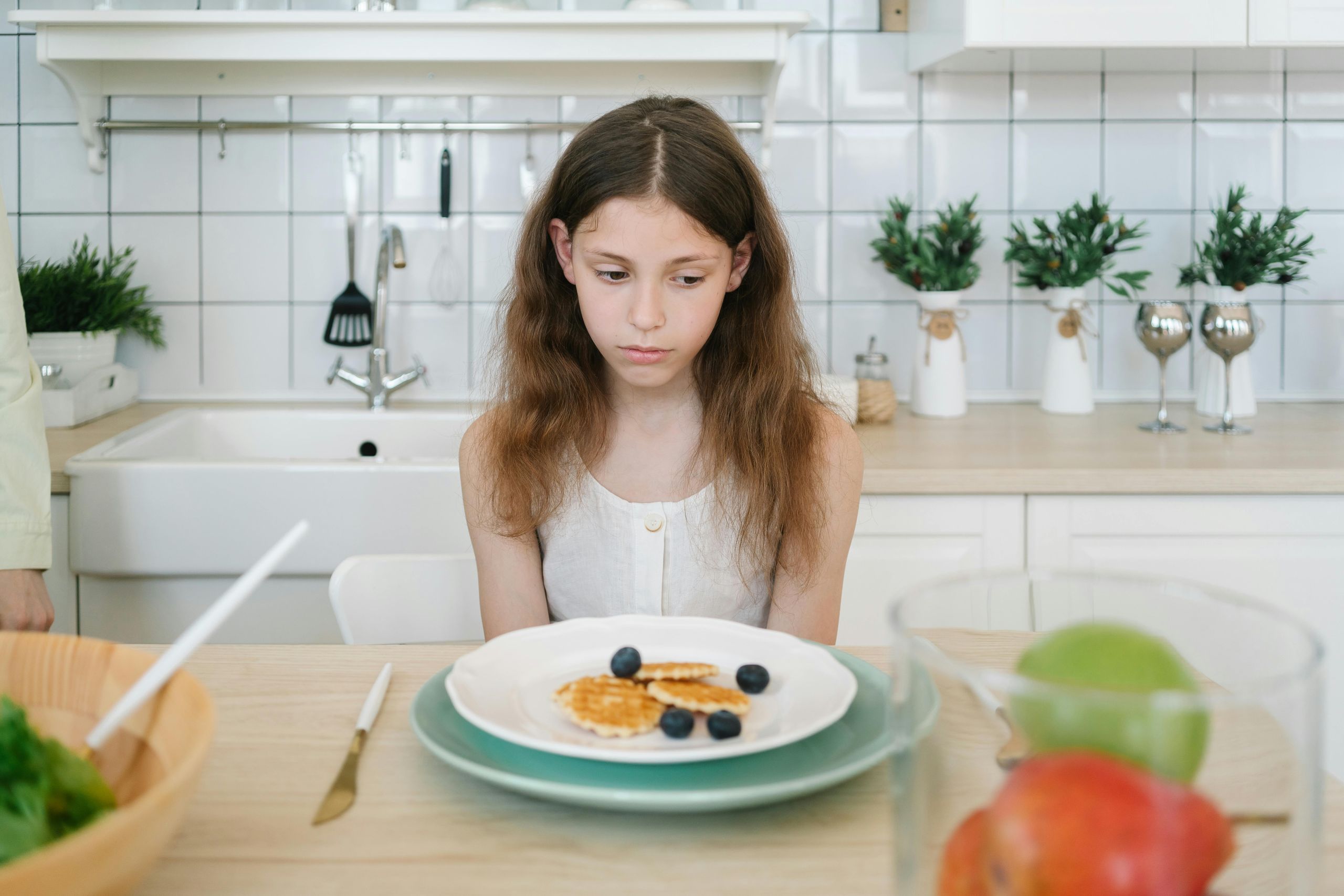 unhappy child refusing food