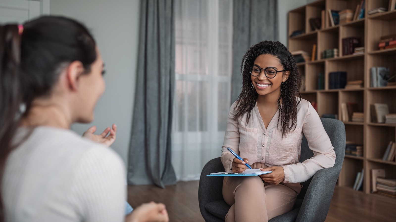 Patient speaking with a psychiatrist during an in-person appointment